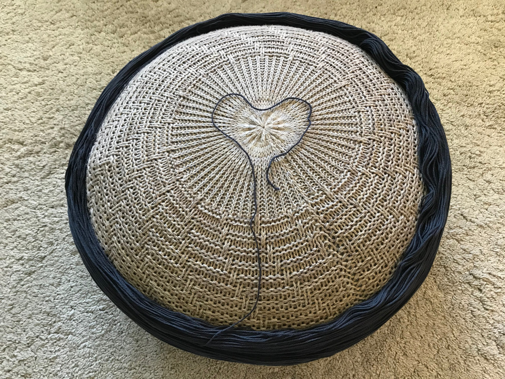 Skein laid around pouf